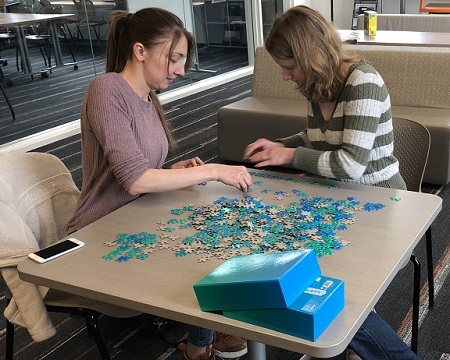 Students working on a puzzle at OSU Cascades.